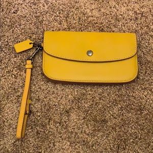 Coach Glovetanned Clutch in Flax.